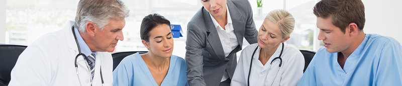 A group of business individuals and doctors meeting regarding their LLP.